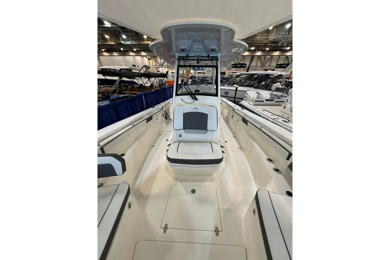 Slide: The Image of 2026 Cobia 305 Center Console boat interior at a boat show. - 18