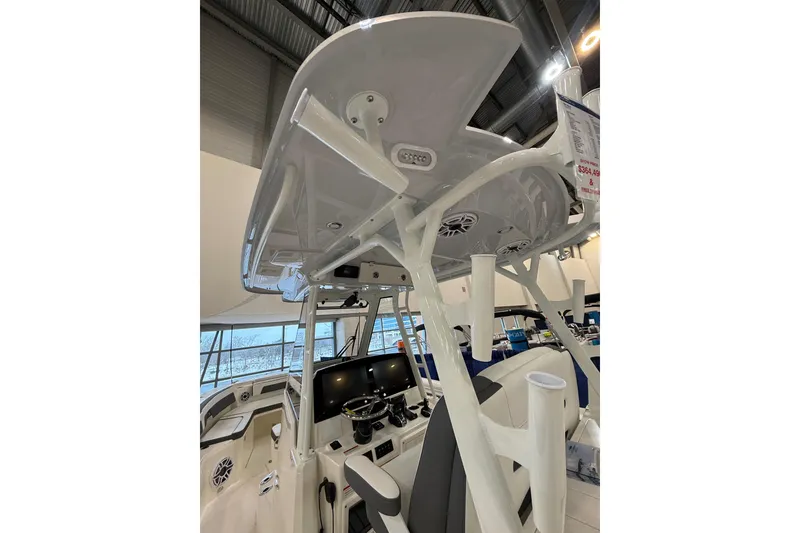 Slide: The Image of 2026 Cobia 305 Center Console boat interior with advanced navigation and seating. - 20