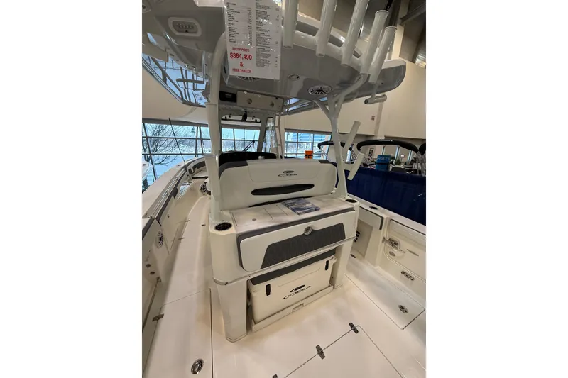 Slide: The Image of 2026 Cobia 305 Center Console boat interior with seating and storage features. - 4