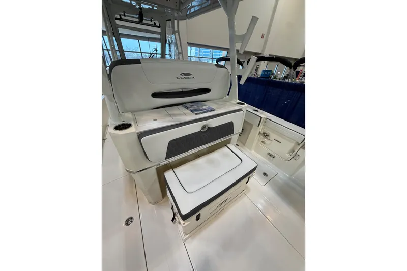 Slide: The Image of 2026 Cobia 305 Center Console boat interior with seating and storage. - 5