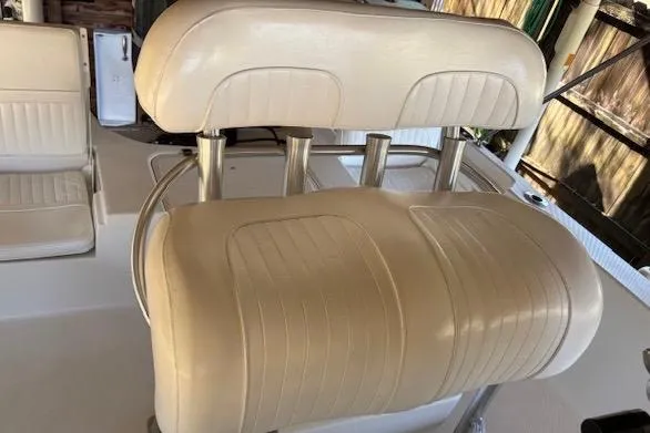 Slide: The Image of Cream-colored seating on a 2012 Seafox 220XT boat, featuring sleek design and comfortable upholstery. - 10