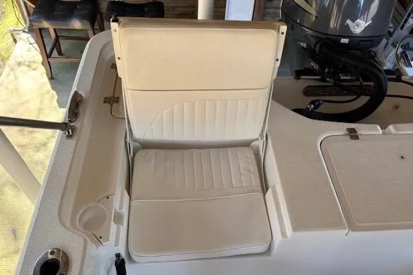 Slide: The Image of 2012 Seafox 220XT boat seat with white cushioned upholstery. - 11