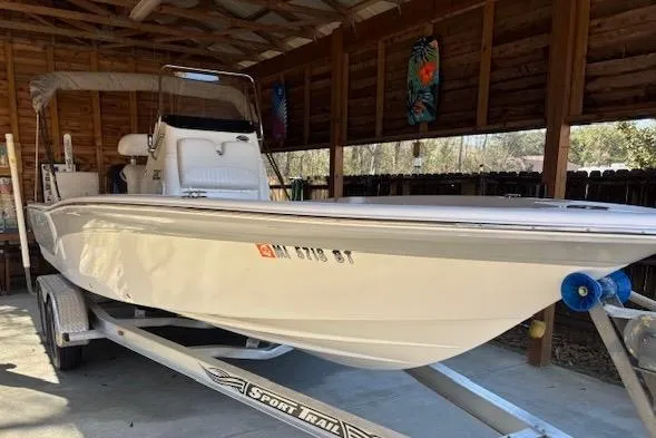 Slide: The Image of 2012 Seafox 220XT boat on trailer in covered storage area. - 2