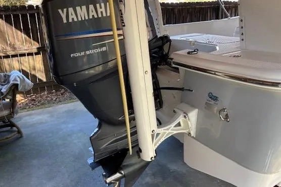 Slide: The Image of 2012 Seafox 220XT boat with Yamaha four-stroke outboard motor in a driveway. - 3