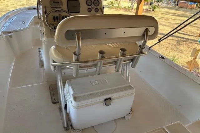 Slide: The Image of 2012 Seafox 220XT boat interior with helm, seating, and cooler storage. - 6