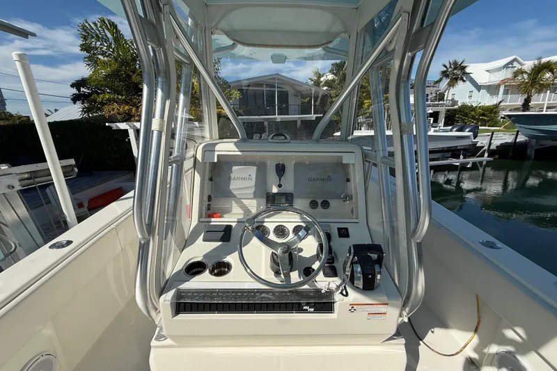 Slide: The Image of 2019 SeaVee 340Z boat cockpit with Garmin navigation system and steering wheel. - 6