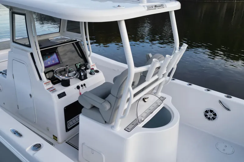 Slide: The Image of 2023 Twin Vee 260 GFX CC boat interior with modern console and seating. - 19