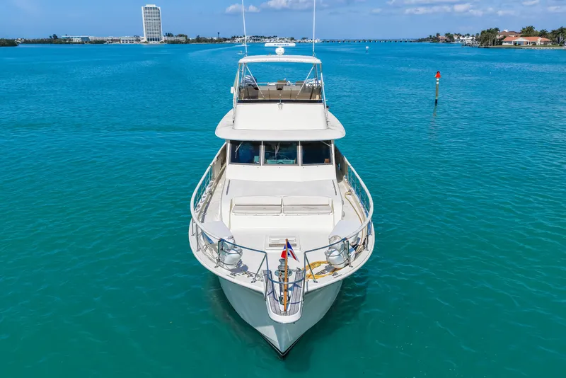 Slide: The Image of 1979 Hatteras 53 Motor Yacht cruising on clear blue waters. - 20