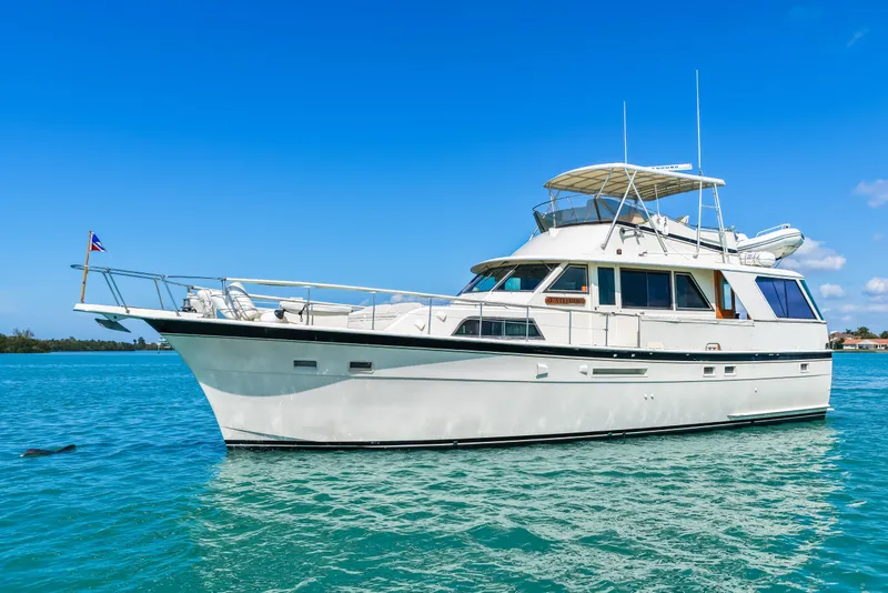 Slide: The Image of 1979 Hatteras 53 Motor Yacht on clear blue water under a sunny sky. - 3