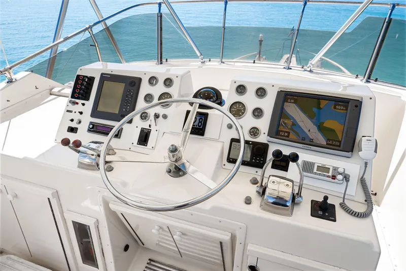 Slide: The Image of 1979 Hatteras 53 Motor Yacht helm with navigation equipment and ocean view. - 30