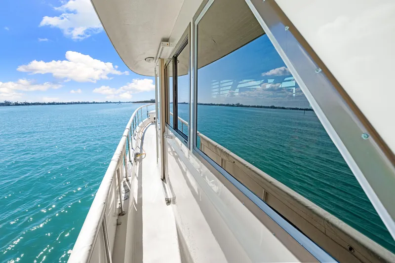 Slide: The Image of 1979 Hatteras 53 Motor Yacht deck view with ocean and sky reflections. - 33
