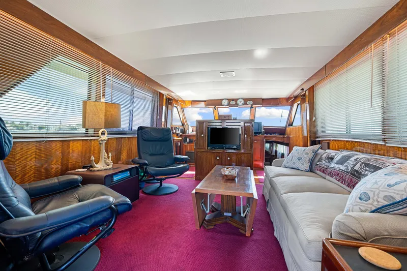 Slide: The Image of Interior of a 1979 Hatteras 53 Motor Yacht with luxurious seating and decor. - 38