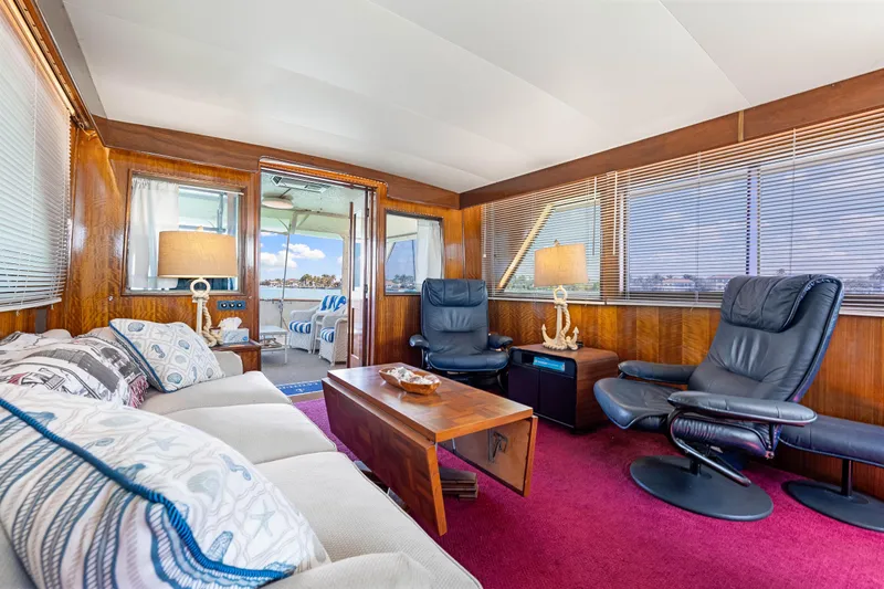 Slide: The Image of Luxurious interior of a 1979 Hatteras 53 Motor Yacht with elegant seating and decor. - 39