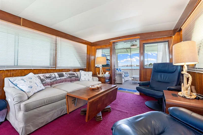 Slide: The Image of Interior of 1979 Hatteras 53 Motor Yacht with cozy seating and nautical decor. - 40