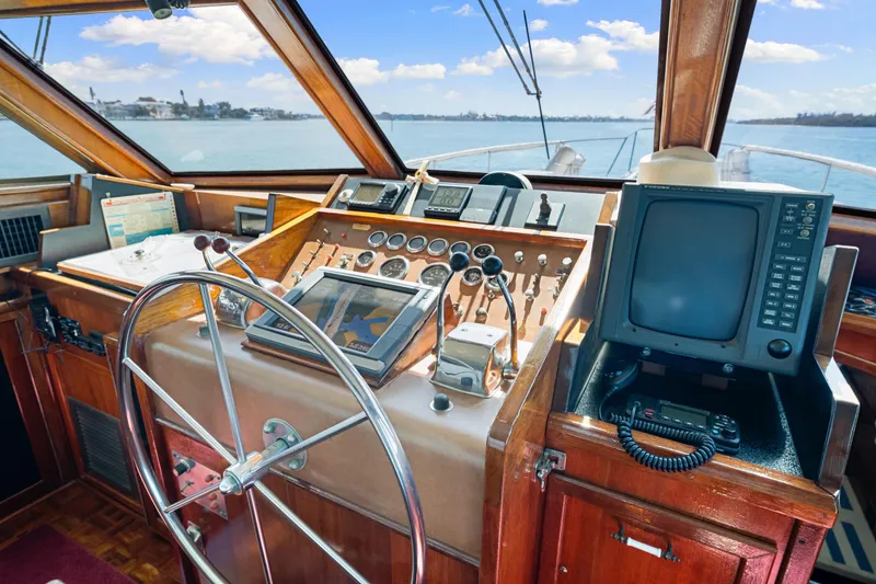 Slide: The Image of 1979 Hatteras 53 Motor Yacht helm with vintage controls and navigation equipment. - 44
