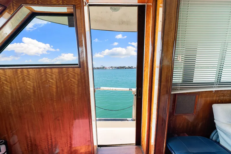 Slide: The Image of Interior view of 1979 Hatteras 53 Motor Yacht with ocean view through open door. - 47