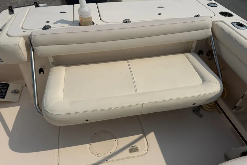 Slide: The Image of 2017 Grady-White Freedom 235 boat interior with foldable seating and cup holders. - 40