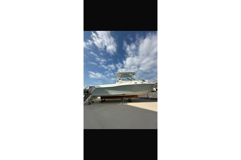 Slide: The Image of 2020 Stamas 326 Aegean boat on dry dock under a blue sky. - 2