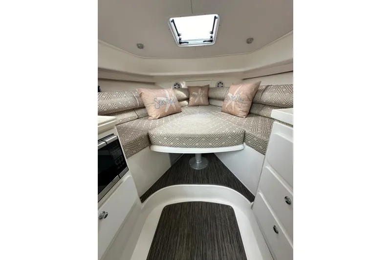 Slide: The Image of 2020 Stamas 326 Aegean cabin interior with cozy seating and decorative pillows. - 7