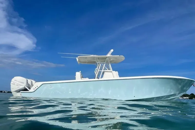 Slide: The Image of 2018 SeaVee 340Z boat on calm water under clear blue sky. - 11