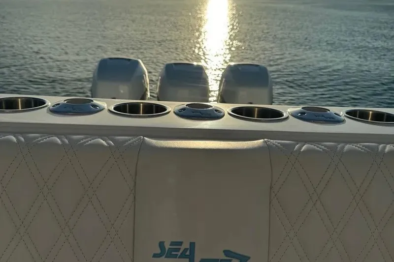 Slide: The Image of 2018 SeaVee 340Z boat with multiple cup holders, sunset reflecting on water. - 5
