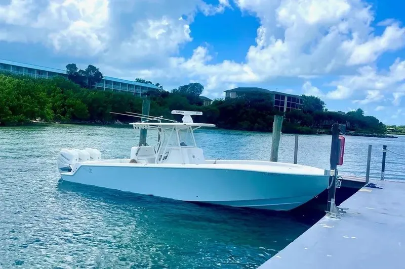 Slide: The Image of 2018 SeaVee 340Z boat docked on a sunny day with blue skies. - 6