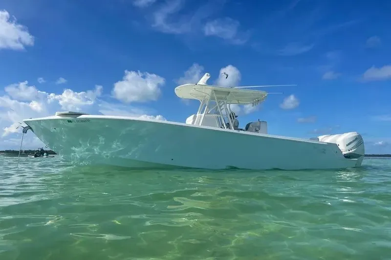 Slide: The Image of 2018 SeaVee 340Z boat on clear water under blue sky. - 7