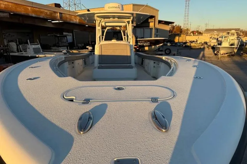 Slide: The Image of 2015 Yellowfin 39 Offshore boat docked, showcasing spacious deck and modern design. - 5