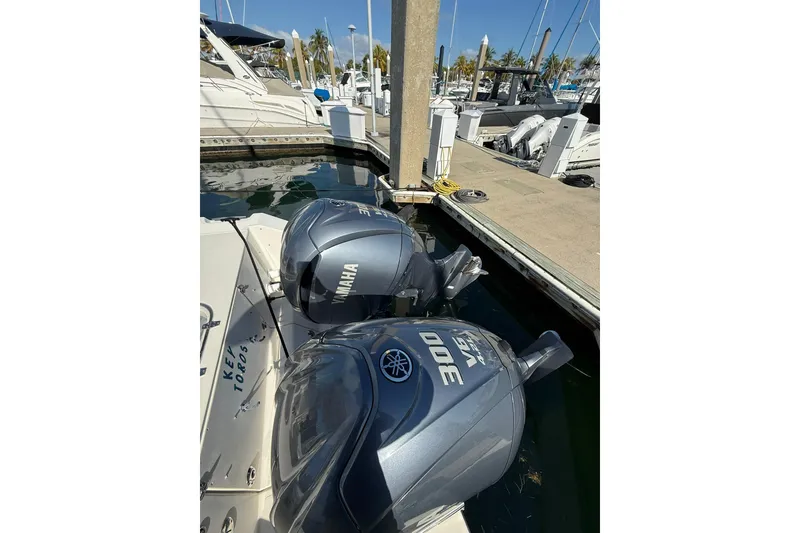 Slide: The Image of 2004 Pursuit 3370 Offshore with Yamaha 300 engines docked at marina. - 12