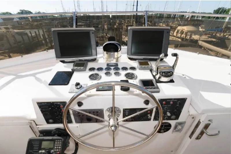 Slide: The Image of Engine room of 1988 Hatteras 54 Motor Yacht, showcasing mechanical components and wiring. - 15