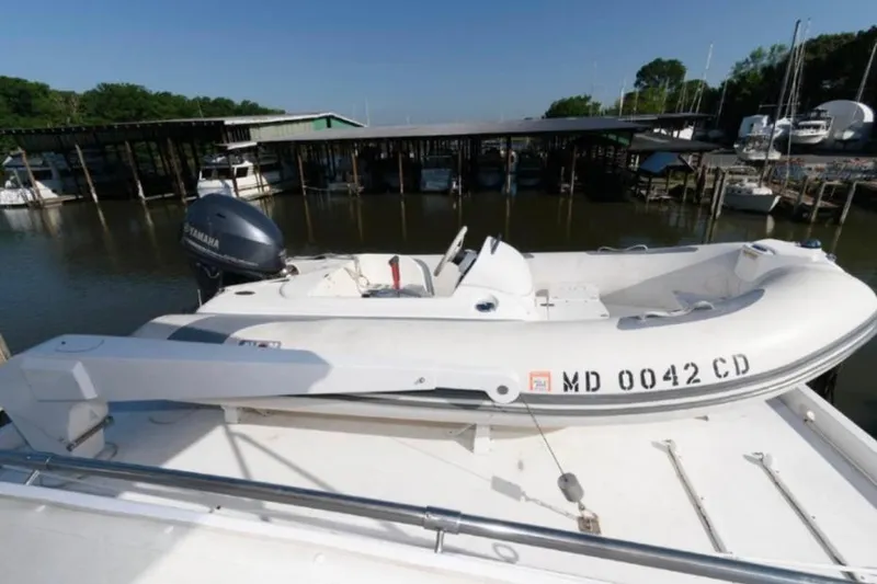 Slide: The Image of 1988 Hatteras 54 Motor Yacht helm with wooden dashboard and modern navigation equipment. - 3