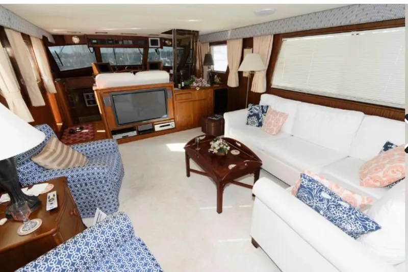 Slide: The Image of Luxurious interior of 1988 Hatteras 54 Motor Yacht with elegant seating and decor. - 6