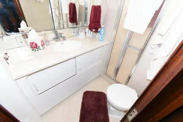 Slide: The Image of Luxurious interior of 1988 Hatteras 54 Motor Yacht with elegant seating and decor. - 7