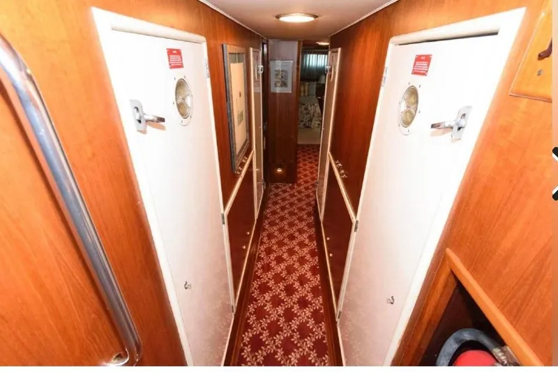 Slide: The Image of Bathroom interior of 1988 Hatteras 54 Motor Yacht with modern fixtures and decor. - 8