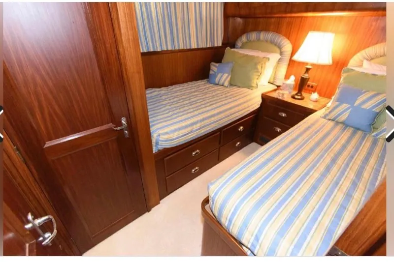 Slide: The Image of Interior hallway of 1988 Hatteras 54 Motor Yacht with wood paneling and patterned carpet. - 9