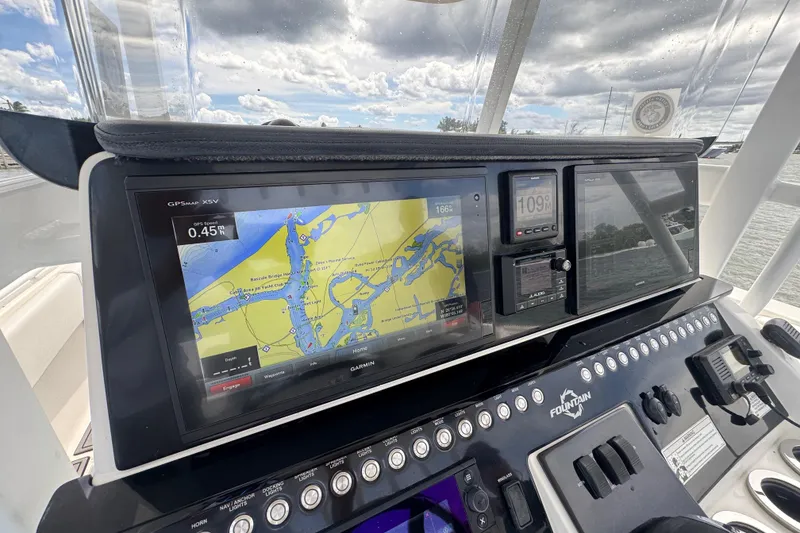 Slide: The Image of 2018 Fountain 34 Center Console dashboard with GPS navigation and control panel. - 20