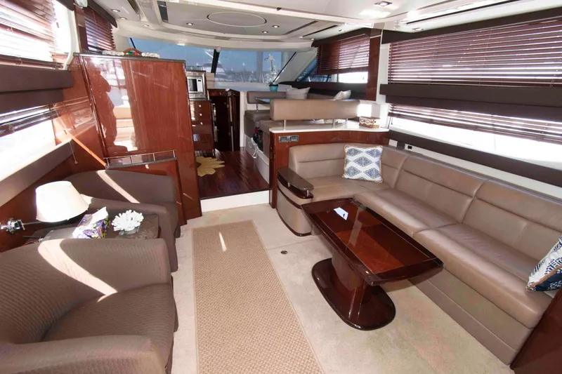 Slide: The Image of Luxurious interior of a 2013 Meridian 441 Sedan yacht with elegant seating and wooden accents. - 16