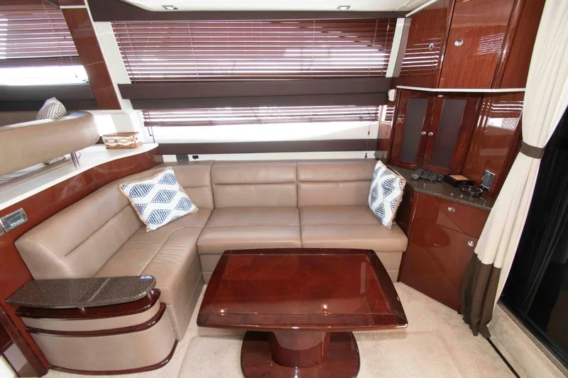 Slide: The Image of Luxurious interior of 2013 Meridian 441 Sedan yacht with leather seating and wooden accents. - 17