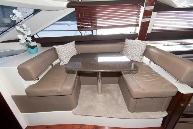 Slide: The Image of Luxurious interior of 2013 Meridian 441 Sedan yacht with plush seating and elegant table. - 21