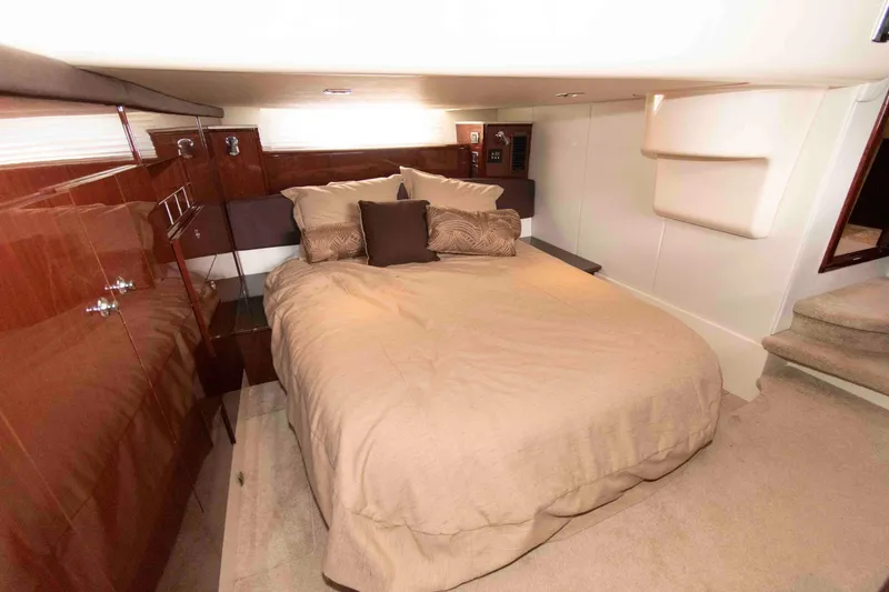 Slide: The Image of Luxurious bedroom interior of 2013 Meridian 441 Sedan yacht with elegant wood paneling. - 23