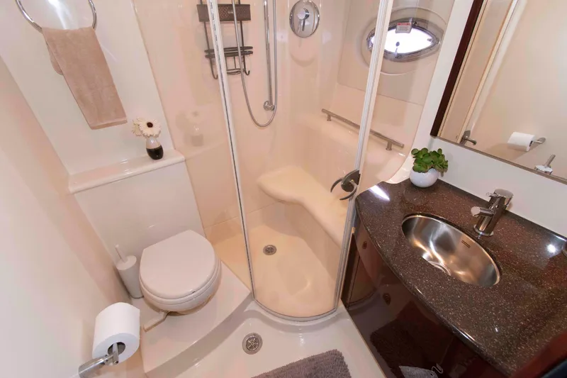 Slide: The Image of Luxurious bathroom in 2013 Meridian 441 Sedan yacht with shower, sink, and toilet. - 24