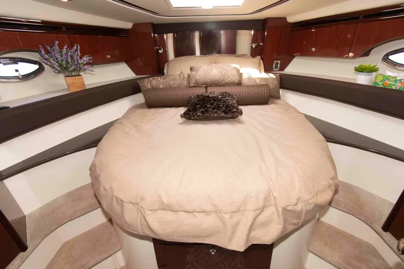 Slide: The Image of Luxurious bedroom interior of a 2013 Meridian 441 Sedan yacht with elegant bedding and decor. - 25