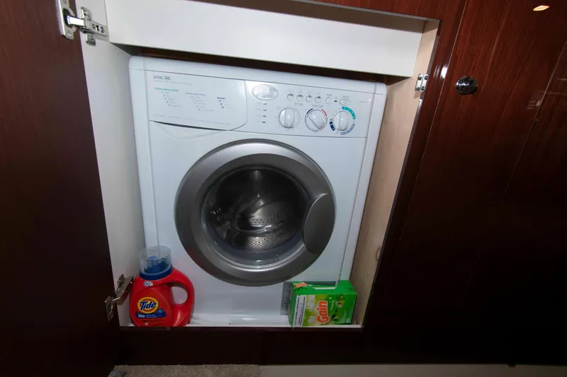 Slide: The Image of Built-in washing machine on 2013 Meridian 441 Sedan yacht with detergent supplies. - 27