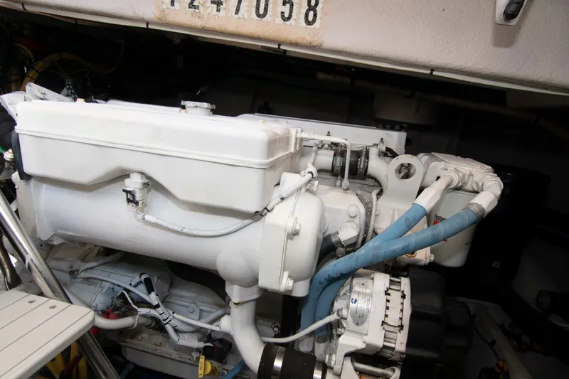 Slide: The Image of Engine compartment of a 2013 Meridian 441 Sedan yacht, showcasing mechanical components. - 29