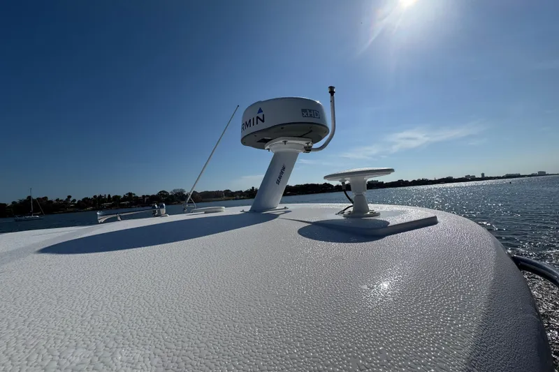 Slide: The Image of 2021 Regal 38 XO boat with Garmin radar on sunny day, ocean view. - 10