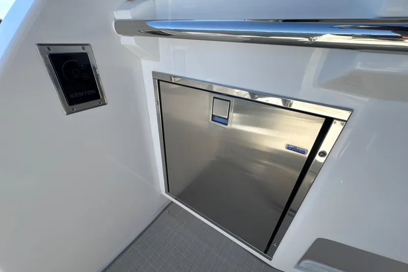 Slide: The Image of Stainless steel appliance on 2021 Regal 38 XO yacht with Kenyon control panel. - 29