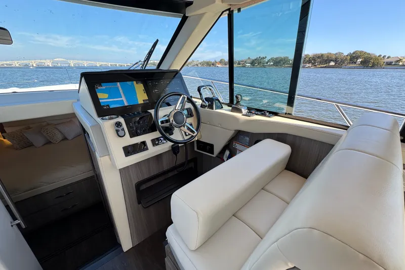 Slide: The Image of 2021 Regal 38 XO yacht interior with modern helm and navigation system. - 31