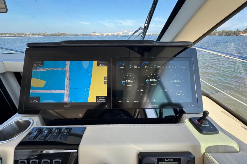 Slide: The Image of Cockpit view of 2021 Regal 38 XO with Garmin navigation displays on a sunny day. - 32