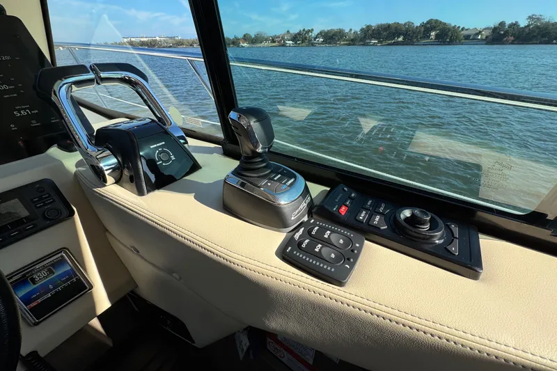Slide: The Image of Control panel of 2021 Regal 38 XO yacht with water view through window. - 33