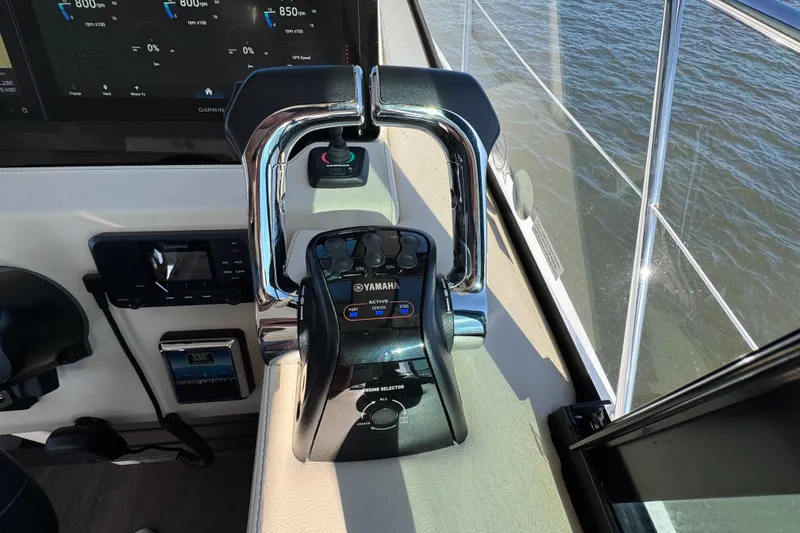Slide: The Image of 2021 Regal 38 XO boat helm with Yamaha controls and Garmin display. - 34